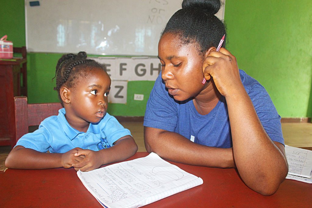 A teacher and a student at Damiefa School