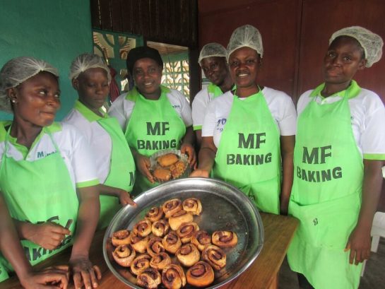 Pastry trainees show off cinnamon rolls at Mineke Foundation