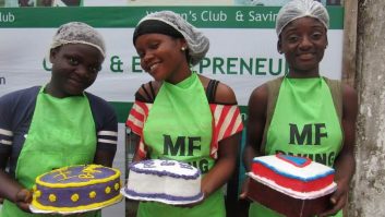 Three pastry trainees pose with decorated cakes at Mineke Foundation